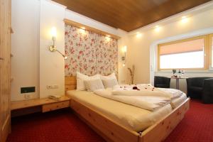 Rúm í herbergi á Hotel Metzgerwirt
