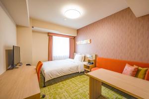 Tabino Hotel lit Matsumoto Milky white Onsenにあるテレビまたはエンターテインメントセンター