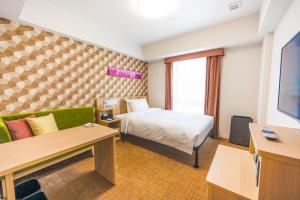 Tabino Hotel lit Matsumoto Milky white Onsenにあるベッド