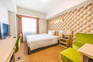 Кровать или кровати в номере Tabino Hotel lit Matsumoto