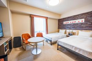 Tabino Hotel lit Matsumoto Milky white Onsenにあるベッド