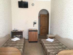 Postel nebo postele na pokoji v ubytování Готель "У Свата" Гришківці Бердичівський р-н