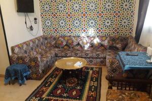 a living room with a couch and a table at Private House with Garden and terrace in Aswan in Aswan
