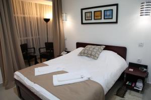Katil atau katil-katil dalam bilik di Hotel Zeder Garni