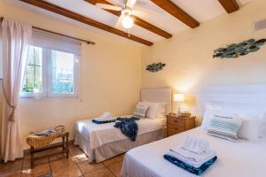 Postel nebo postele na pokoji v ubytování Casa Jazmin