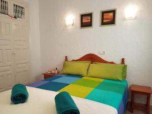 Cama o camas de una habitación en Toscamar Jardin