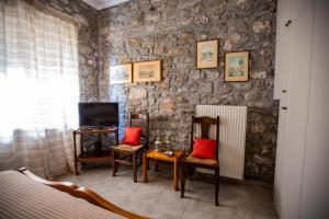 Televízia a/alebo spoločenská miestnosť v ubytovaní Amaryllis Holiday Home