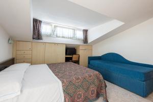 מיטה או מיטות בחדר ב-Margherita Family Apartments