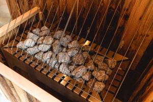 a rack of hamburgers are cooking in an oven at Matreier Tauernhaus in Matrei in Osttirol