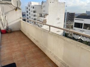 a balcony with a view of a city at Appartment Anjou in Casablanca