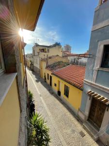 an empty street in a city with buildings at Back to the past in Olbia