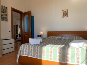 Posteľ alebo postele v izbe v ubytovaní House Sole e Mare by Holiday World