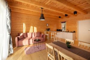 a living room with a couch and a table at Osada Zator Family Resort & SPA in Zator