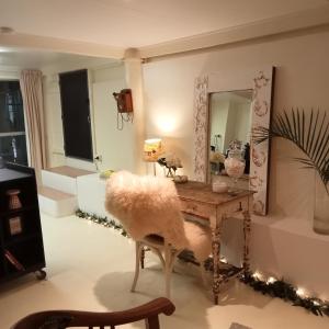 a dressing room with a table and a mirror at Bronnies Place in Gatton