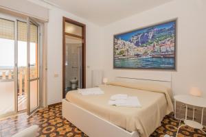 Postel nebo postele na pokoji v ubytování Hotel Rosy