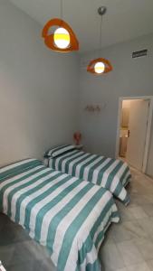 Posteľ alebo postele v izbe v ubytovaní New Samay Hostel