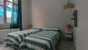 Posteľ alebo postele v izbe v ubytovaní New Samay Hostel