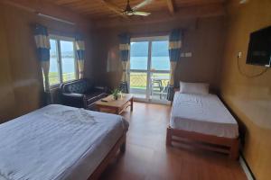 Ліжко або ліжка в номері Hotel waterside