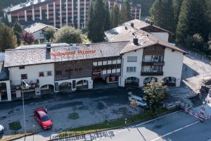 an aerial view of a hotel with a parking lot at Cristallina A2 in Laax