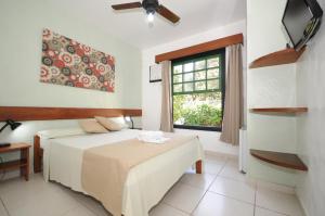 Katil atau katil-katil dalam bilik di Pousada Sonho Verde