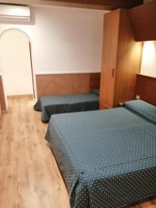 Posteľ alebo postele v izbe v ubytovaní Hotel Verona Rome