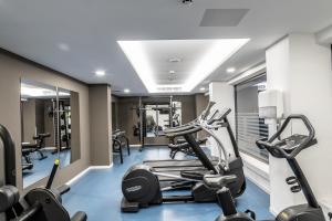 a gym with treadmills and elliptical machines at Faros Hotel Ayia Napa in Ayia Napa