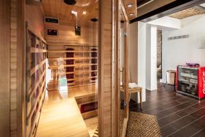 a room with wood paneling and a glass wall at GL Suites in Wiesbaden