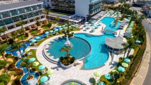 an overhead view of a pool at a resort at Faros Hotel Ayia Napa in Ayia Napa
