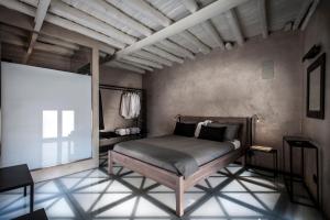 a bedroom with a bed and a projection screen at Case D'a Mare Mondello in Mondello