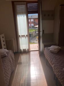 Postel nebo postele na pokoji v ubytování Hotel Posta