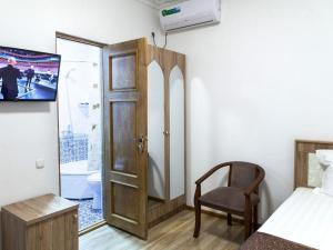 TV a/nebo společenská místnost v ubytování Boutique NABIBEK