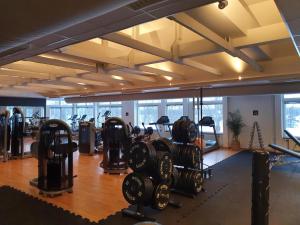 a gym with lots of treadmills and exercise equipment at Systemairhallen Bed&Breakfast in Skinnskatteberg +14 photos