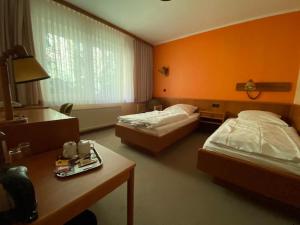 Posteľ alebo postele v izbe v ubytovaní Hotel Tanneneck