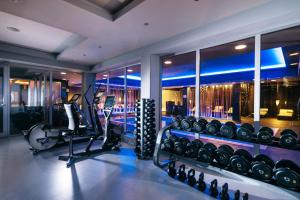 a fitness room with a gym with tread machines at Hotel Aleksander Medical & SPA in Rogaška Slatina