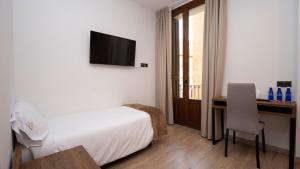 A bed or beds in a room at Encanto Tarazona