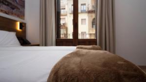 A bed or beds in a room at Encanto Tarazona