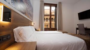 A bed or beds in a room at Encanto Tarazona