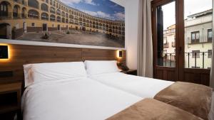 A bed or beds in a room at Encanto Tarazona
