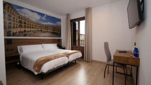 A bed or beds in a room at Encanto Tarazona
