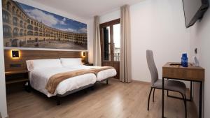 A bed or beds in a room at Encanto Tarazona