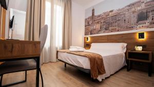 A bed or beds in a room at Encanto Tarazona