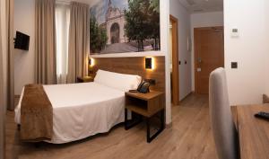 A bed or beds in a room at Encanto Tarazona