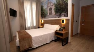 A bed or beds in a room at Encanto Tarazona