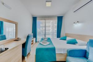 Letto o letti in una camera di Hotel Obala