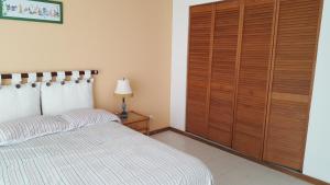 Postel nebo postele na pokoji v ubytování Apartamento Edificio Sea View