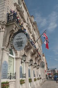 a building with a sign on the side of it at The Ship Leopard Boutique Hotel - No Children in Portsmouth