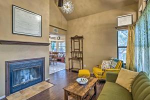 a living room with a couch and a fireplace at Lago Vista Lake Home with Shared Dock and Kayaks! in Lago Vista