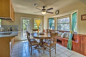 a kitchen and dining room with a table and chairs at Lago Vista Lake Home with Shared Dock and Kayaks! in Lago Vista