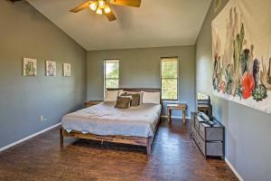 a bedroom with a bed and a ceiling fan at Lago Vista Lake Home with Shared Dock and Kayaks! in Lago Vista
