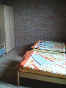 Postel nebo postele na pokoji v ubytování CIMA-pre nenáročných